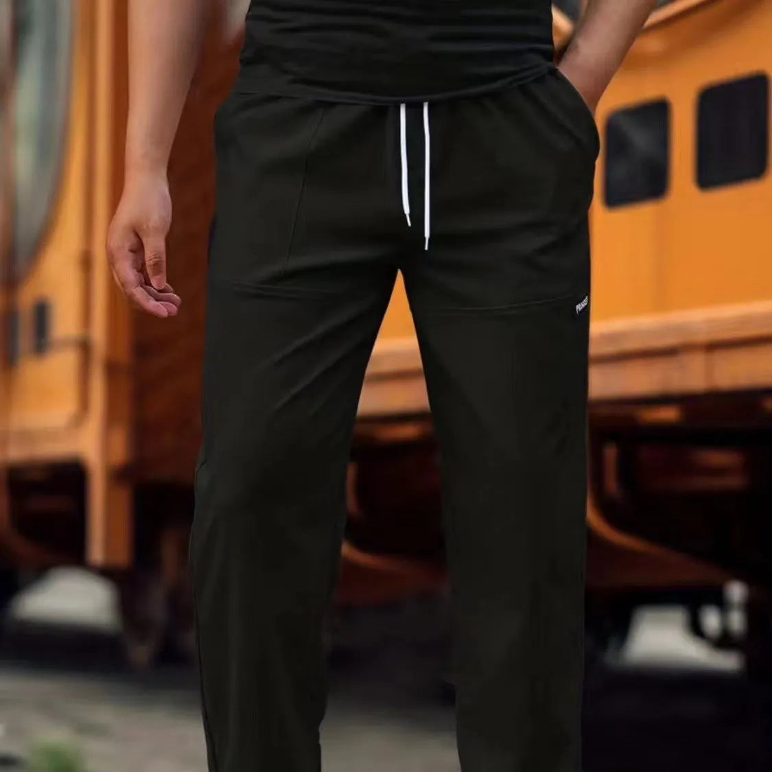 Men's light grey polyester trousers for spring and autumn casual wear, shown in Asian sizing.