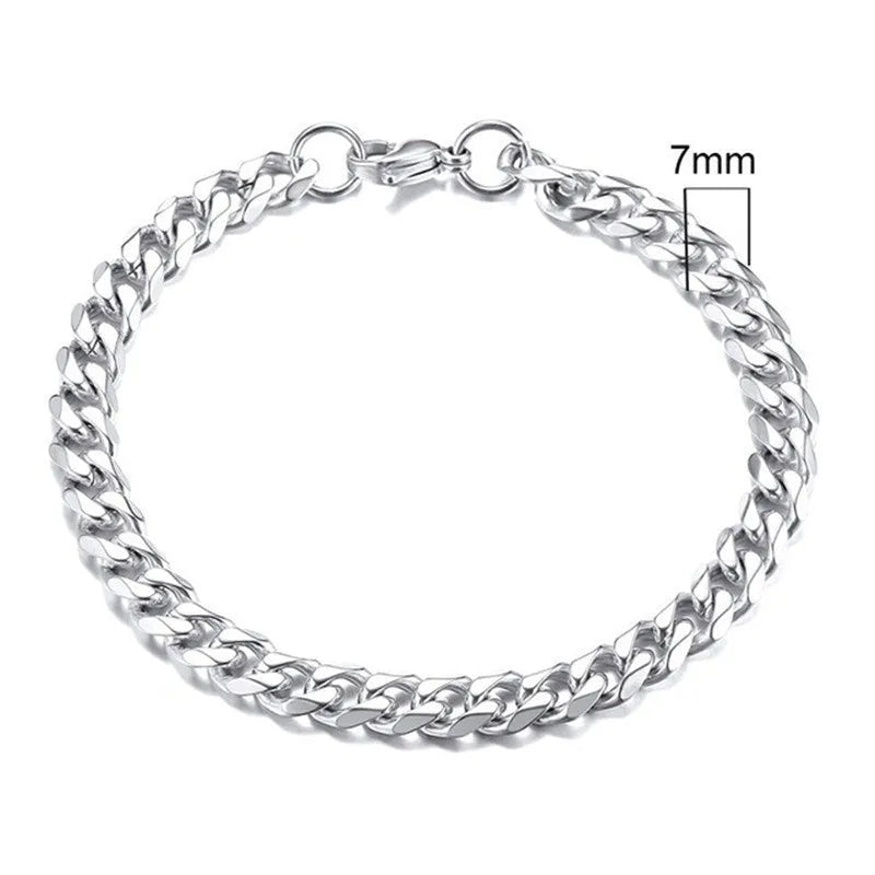 Six-sided geometric link metal bracelet in gold colour on a wrist.