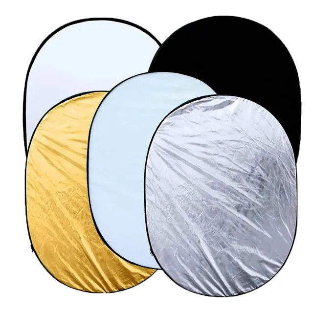 5-in-1 portable photography reflector with gold silver white black translucent surfaces folded next to carrying bag