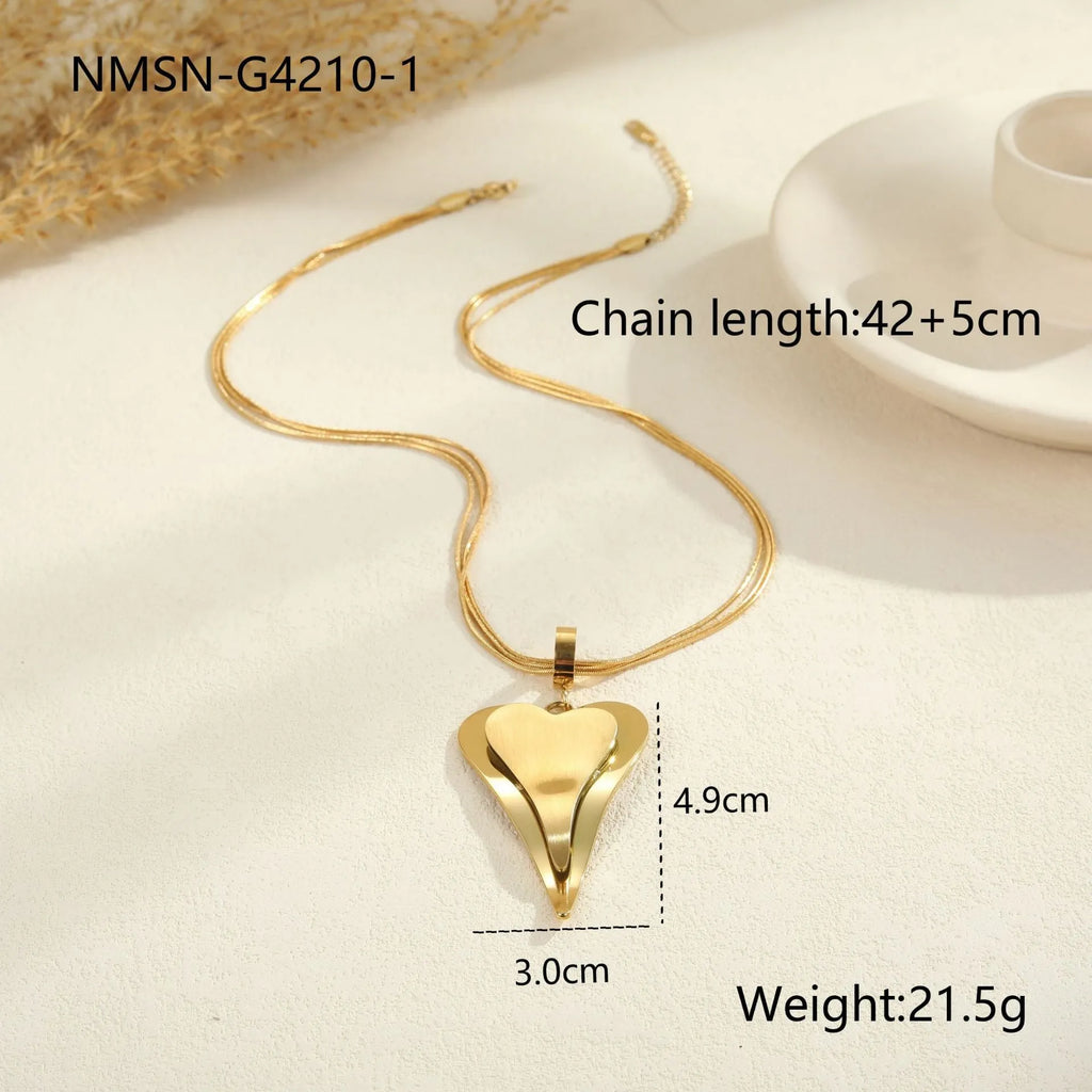 Geometric double heart pendant on a stainless steel snake bones chain necklace in gold or steel finish.
