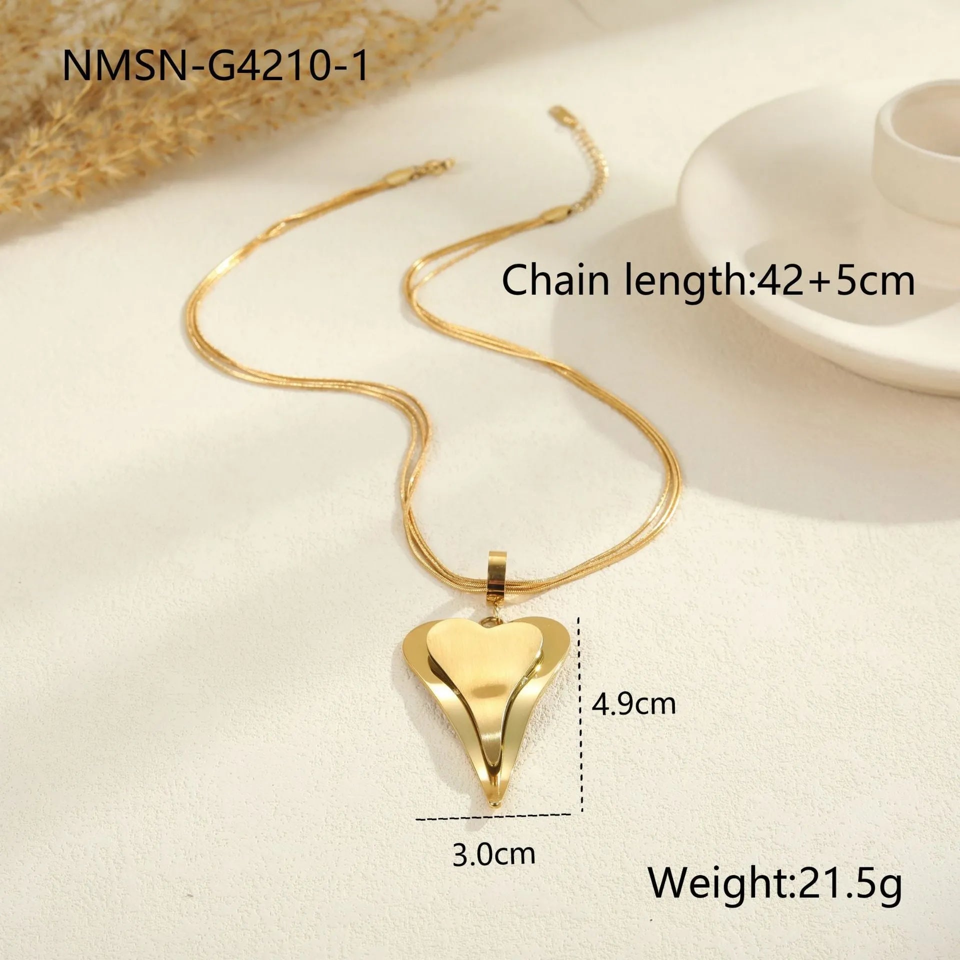 Geometric double heart pendant on a stainless steel snake bones chain necklace in gold or steel finish.