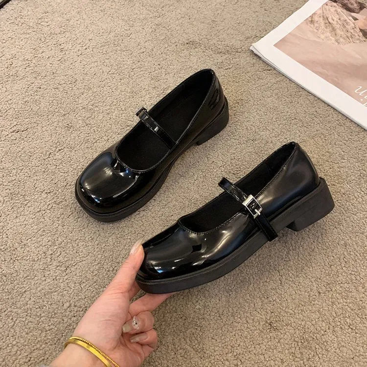 Women's solid colour flat heel loafers in red, black, or greyish black.