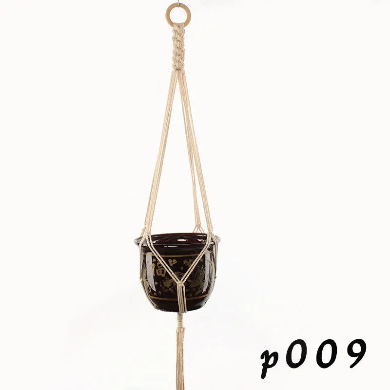 Woven cotton rope plant holder in a desktop style with greenery inside.