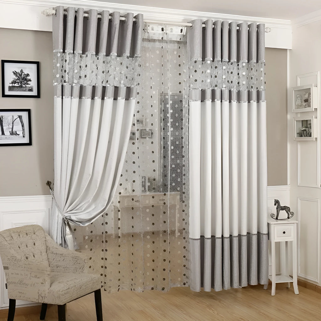 Simple blackout curtain panel hanging, showing light-blocking fabric and hook heading style.
