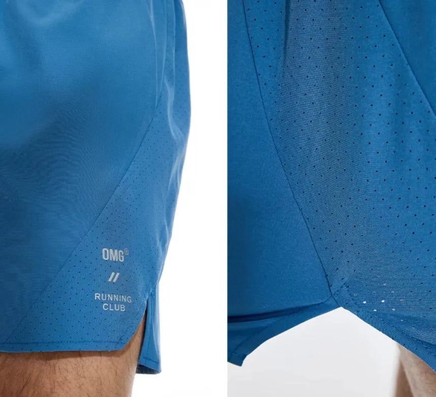 Men's black running shorts with laser stitching detail on a grey background