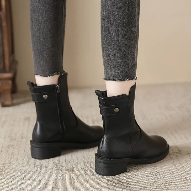 Black women's low heel side zip ankle boots with round toe on a white background.