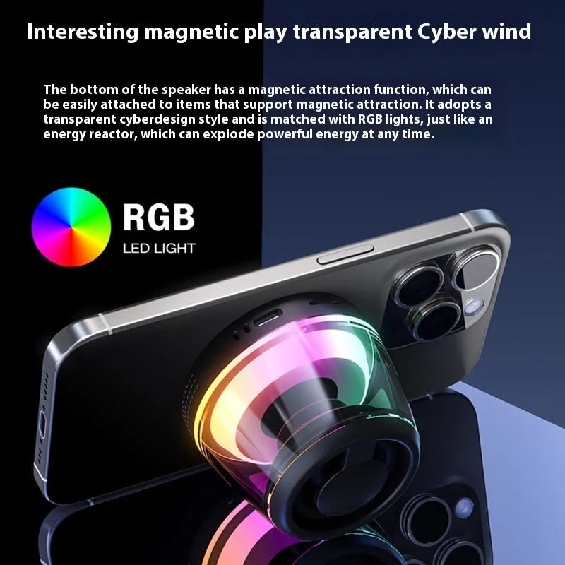 Black and white portable Bluetooth speaker with magnetic base and ambient lighting on desktop