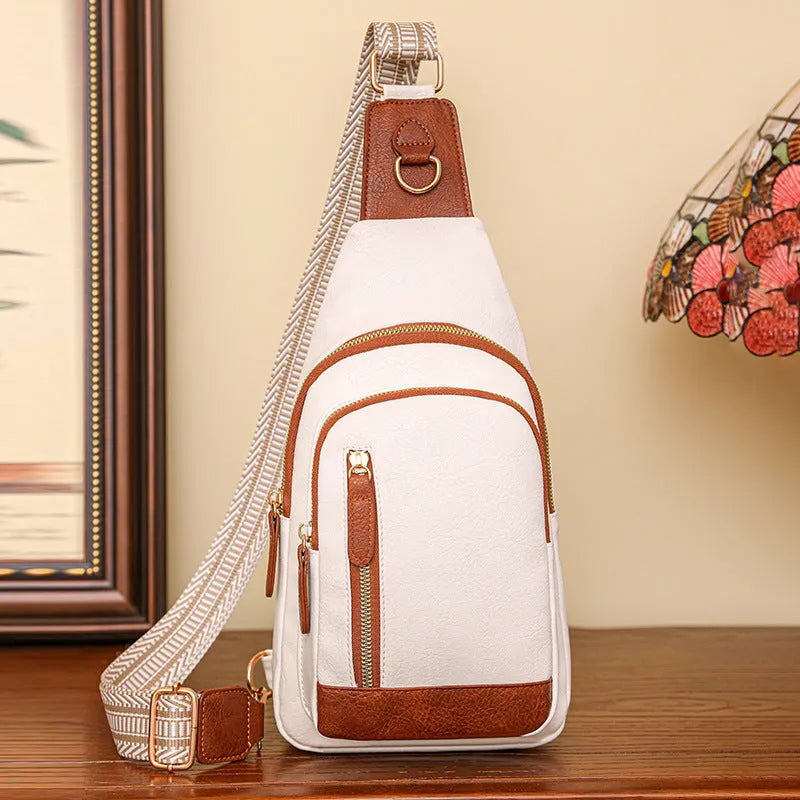 Women's soft brown PU crossbody chest bag showing open outer pocket and street style design