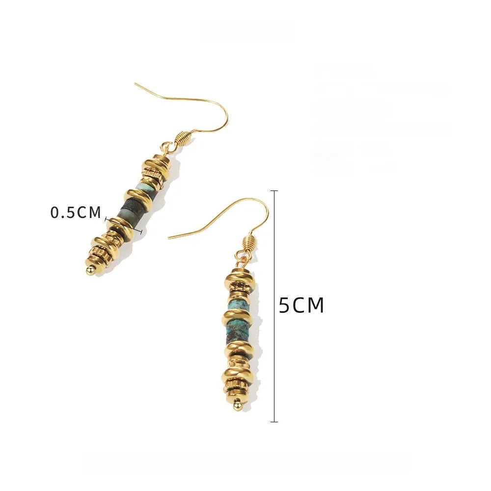 Pair of silver geometric-shaped titanium steel dangle earrings with an 18K gold finish.