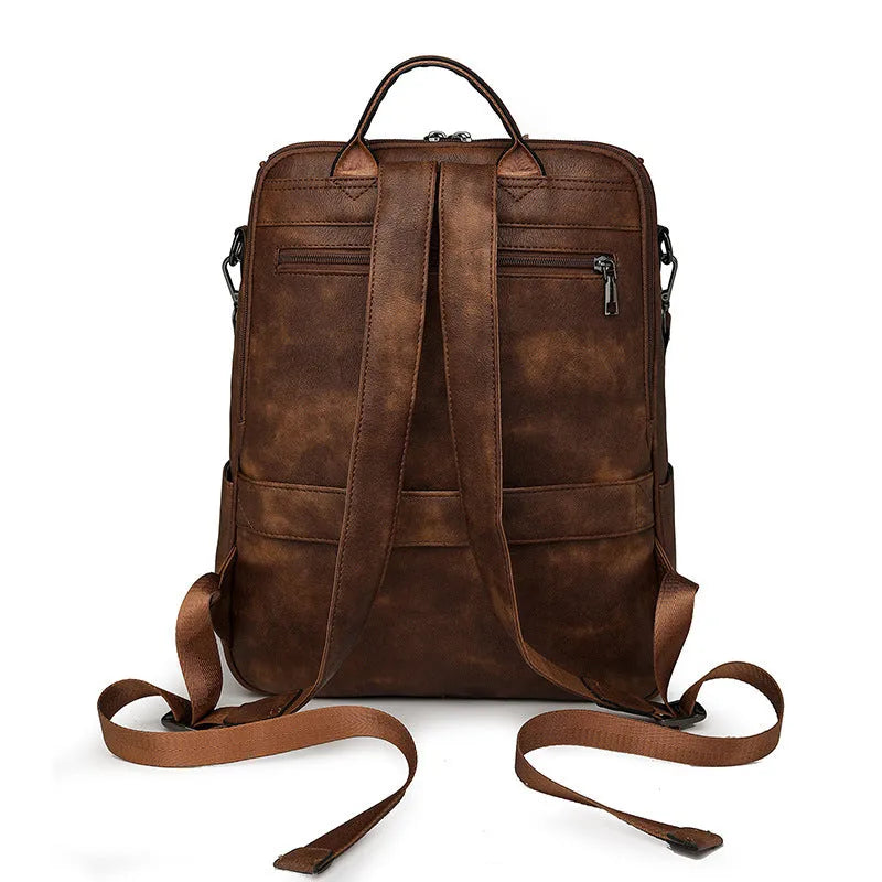 Retro college backpack in PU material with a curved shoulder strap shown in multiple colour options.