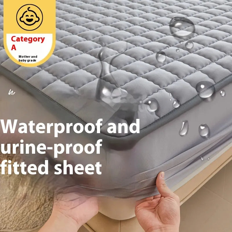 Blue washed cotton waterproof fitted sheet with elasticated corners shown on mattress