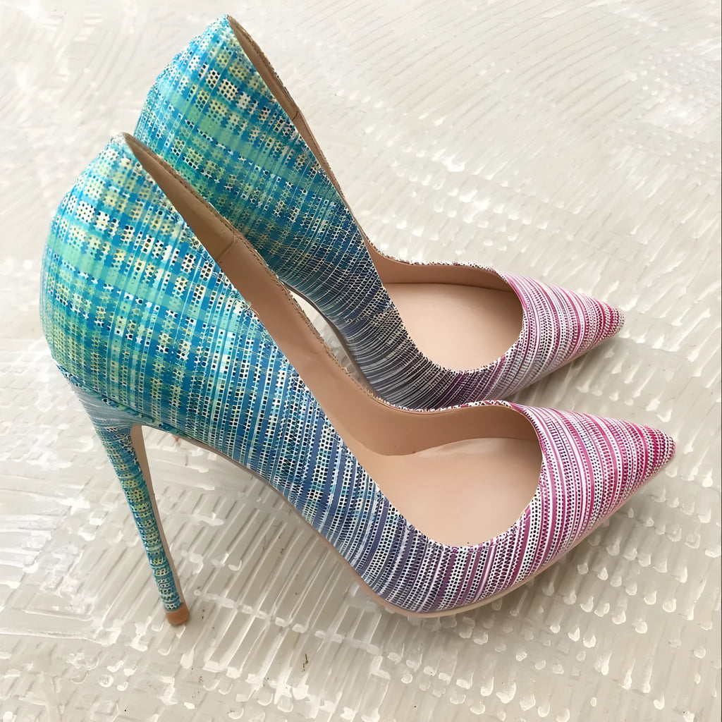 Ladies high heel shoes with a pink to blue gradient colour, pointed toe, and a tall thin heel.