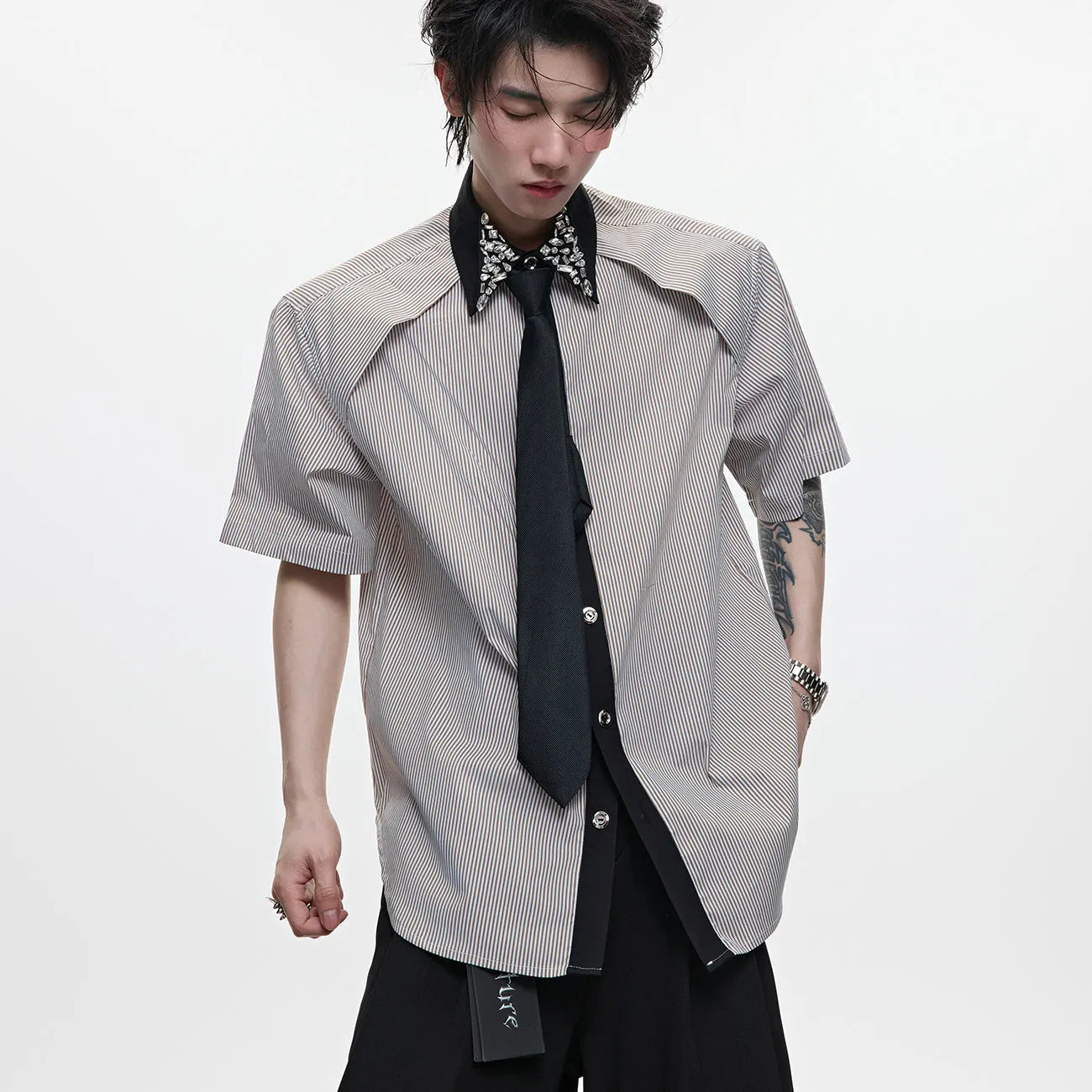 Men's blue loose fit diamond tie patchwork striped shirt with flip collar and button decorations.