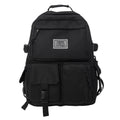 Black and white nylon student backpack with laptop compartment and three-dimensional pockets