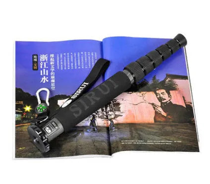 Black carbon fibre SLR camera monopod extended to full 1540mm height with six telescopic sections