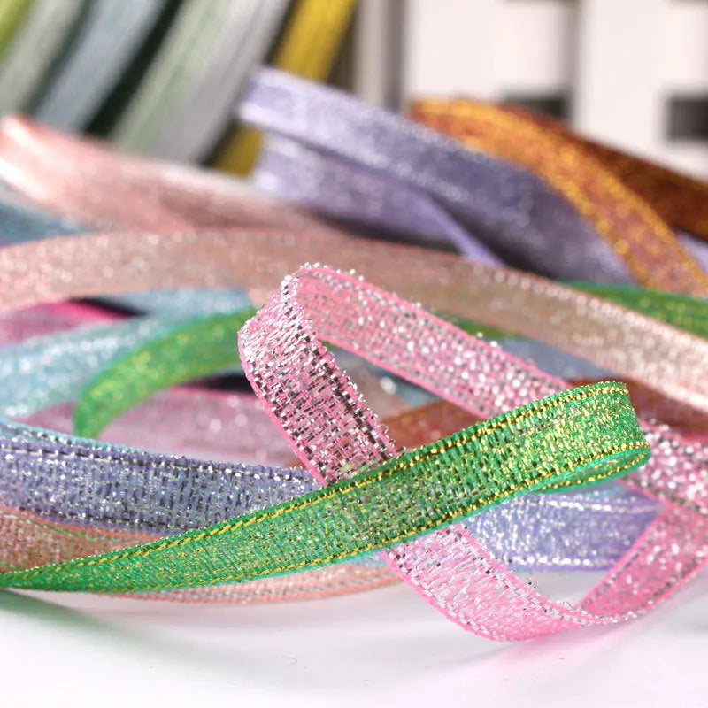 Roll of polyester gift ribbon showing 0.6cm width and multiple colour options including metallic finishes