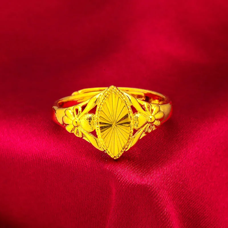 Gold geometric flower ring with textured brass construction and open diamond design