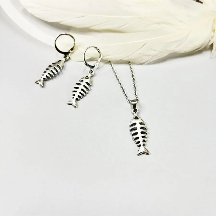 Women's fishbone pendant alloy necklace and matching earrings set on a white background