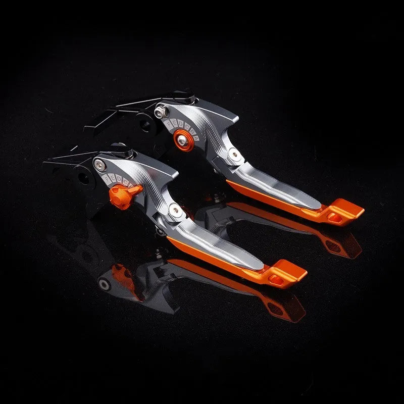 Pair of anodised metal motorcycle brake and clutch levers with adjustable length mechanism
