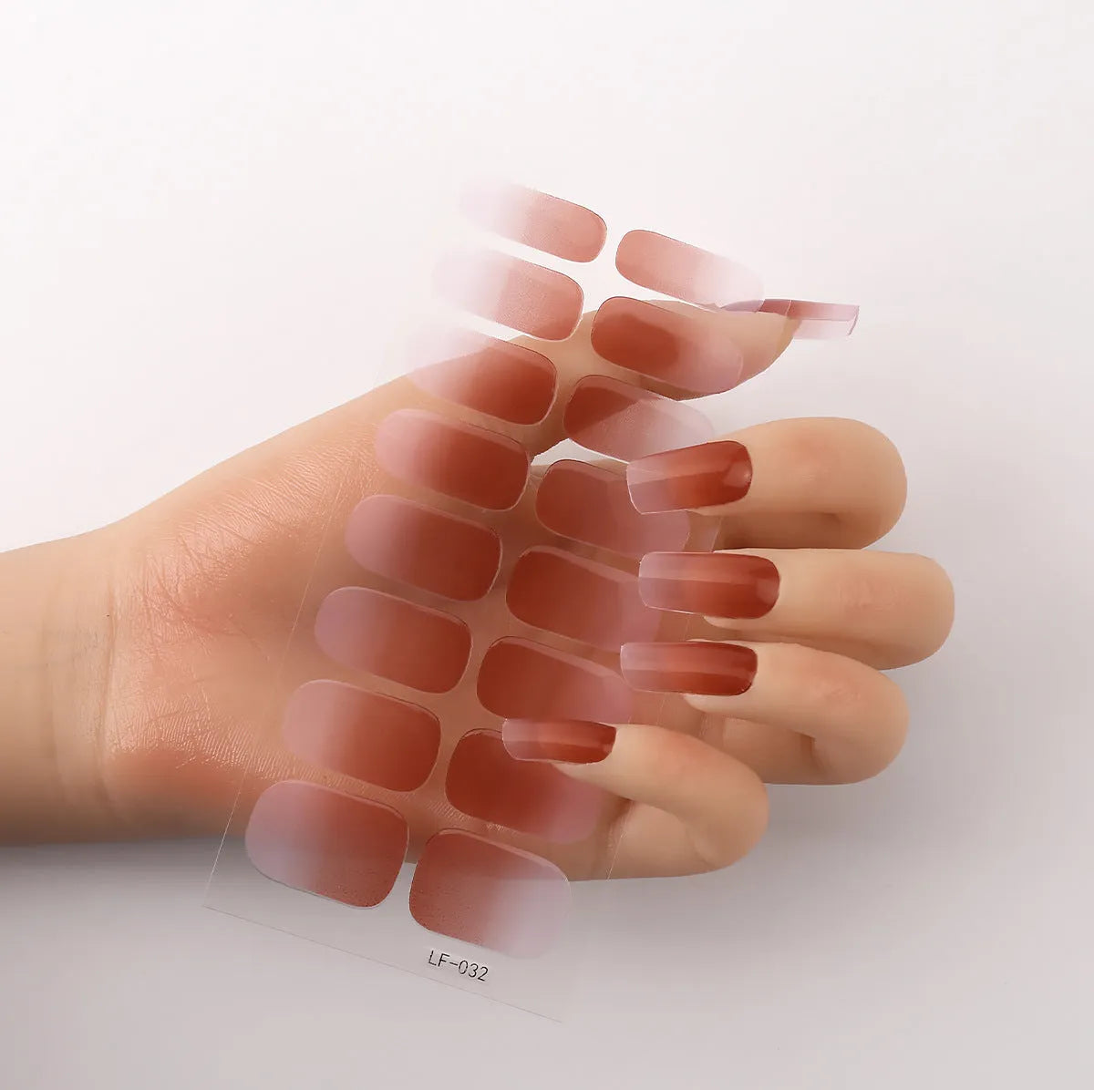 Sheet of 16 solid colour nail art sticker designs including cross, rose, and leopard print patterns.