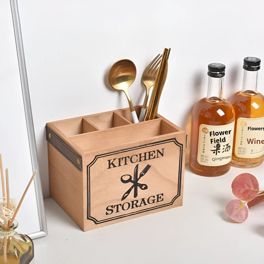 Natural wooden kitchen storage box with internal grid dividers for organising knives, forks, and chopsticks.