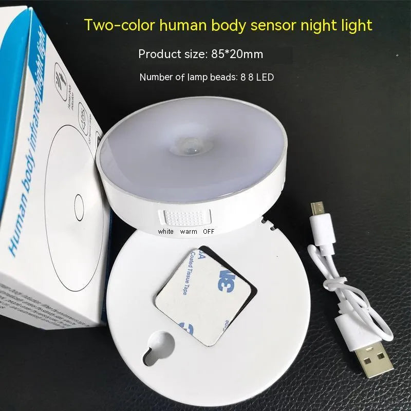 White USB rechargeable LED body induction night light with adhesive backing showing 86mm diameter