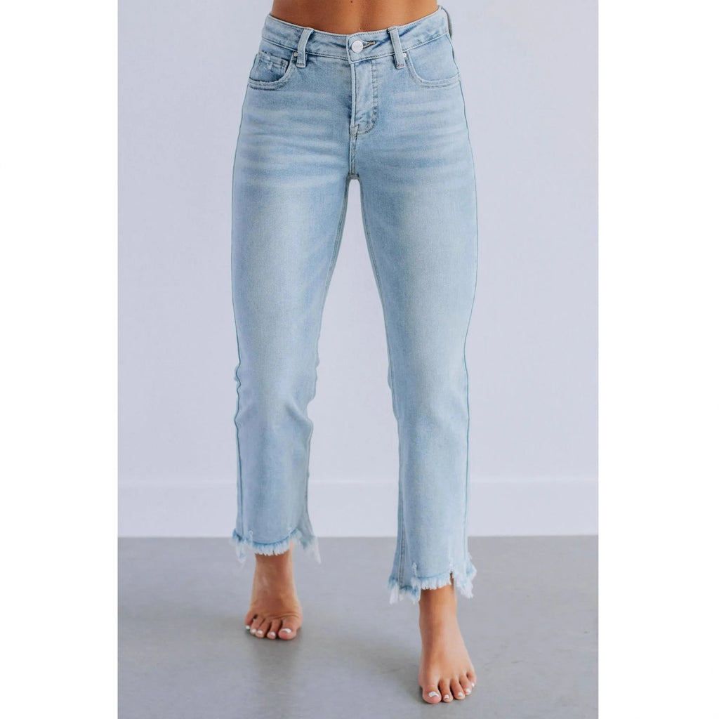Women's dark blue cotton denim jeans with hand-distressed detailing and casual styling
