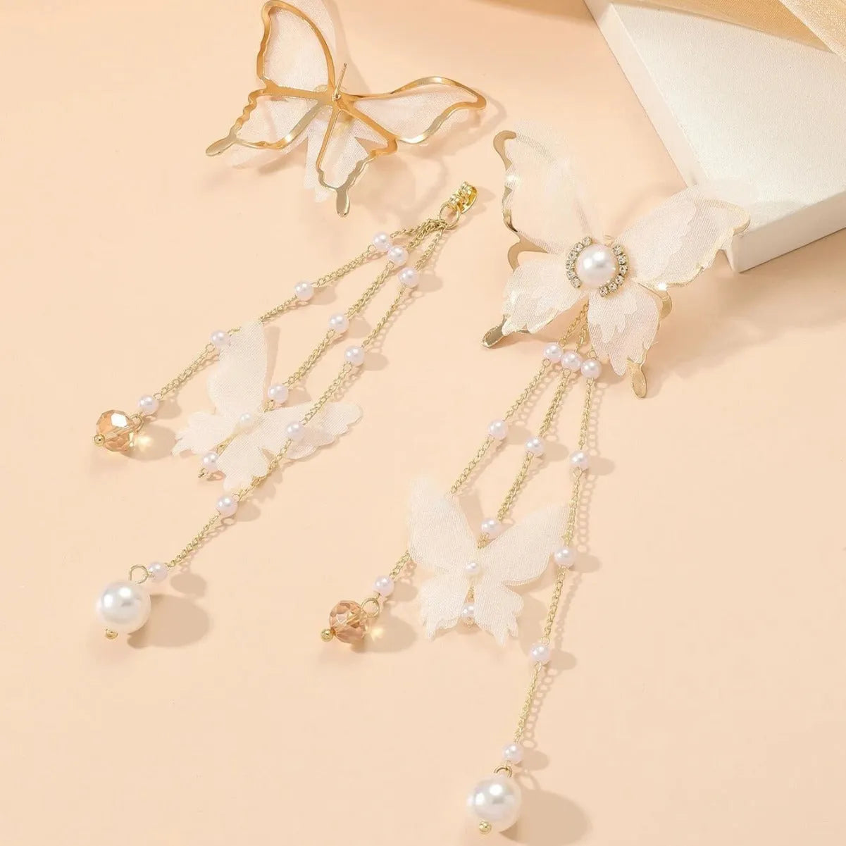 White butterfly earrings with tassel lace pearls and rhinestone decorations on copper alloy