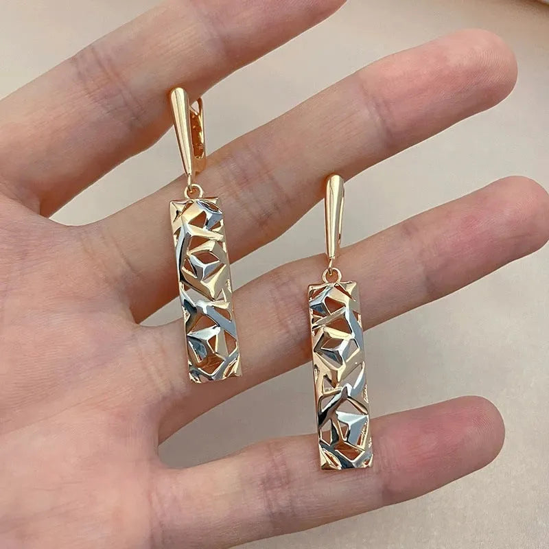 Rectangular two-tone hollow stud earrings with geometric openwork centre and electroplated finish