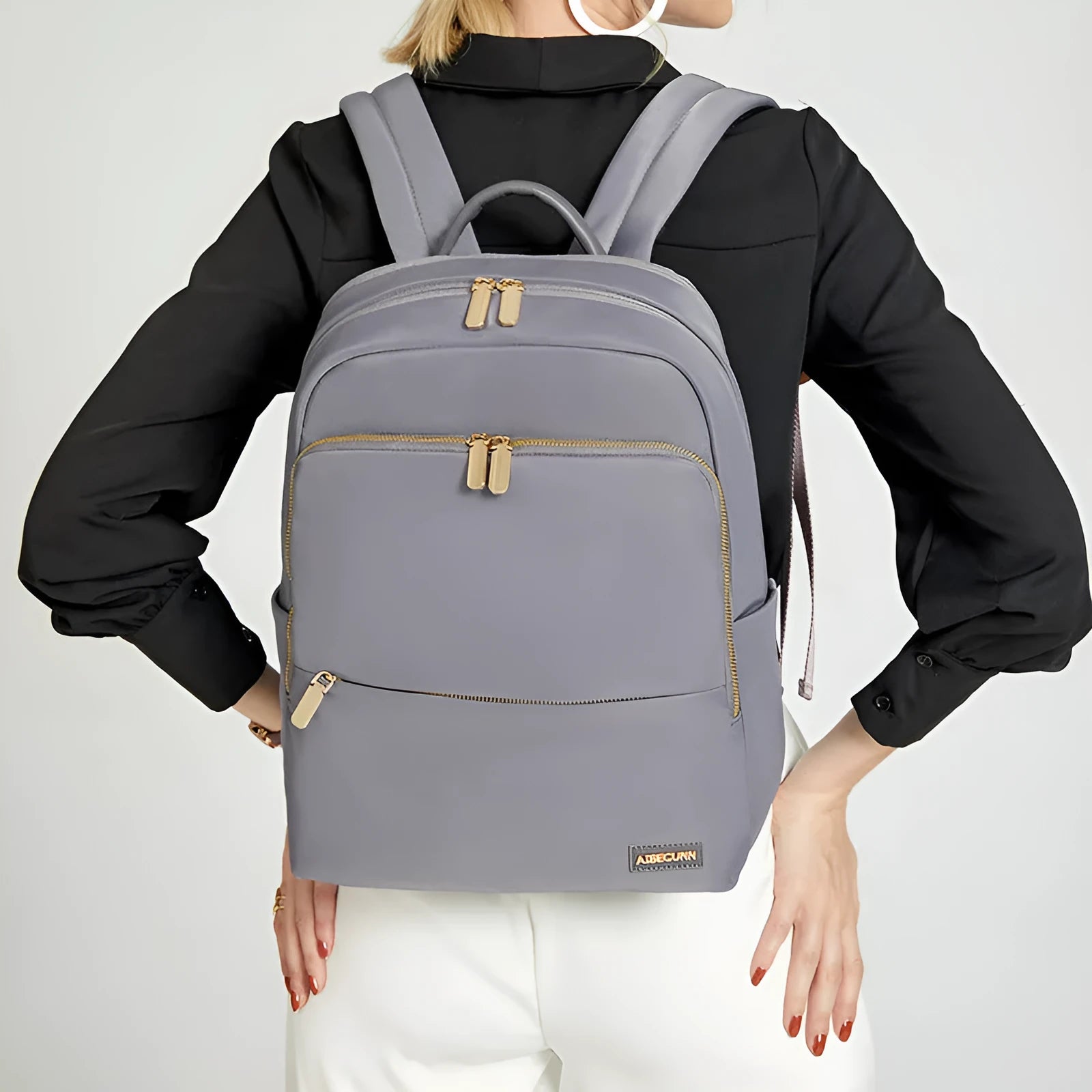 Large capacity black Oxford cloth women's backpack with shoulder straps.
