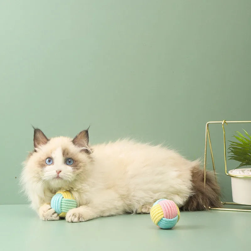 Handmade cotton cat plush hair ball toys in three colour options on white background