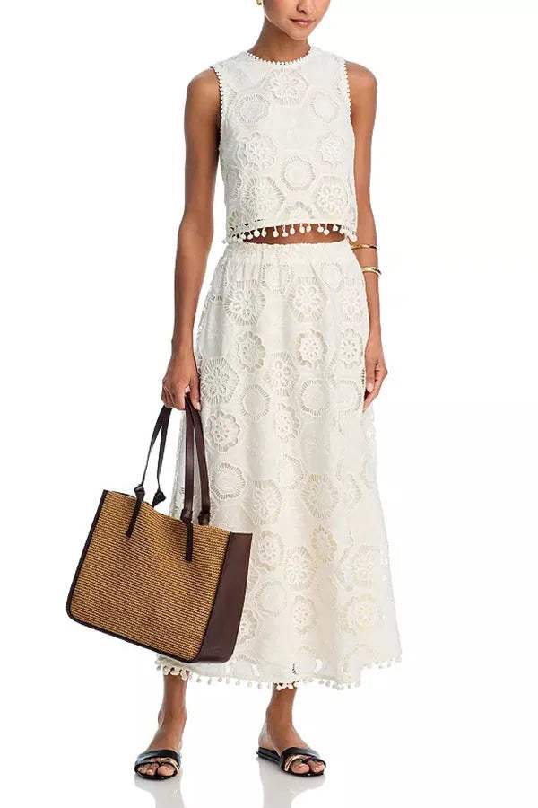 Women's white two-piece suit set with sleeveless top, long skirt, and retro embroidery detail