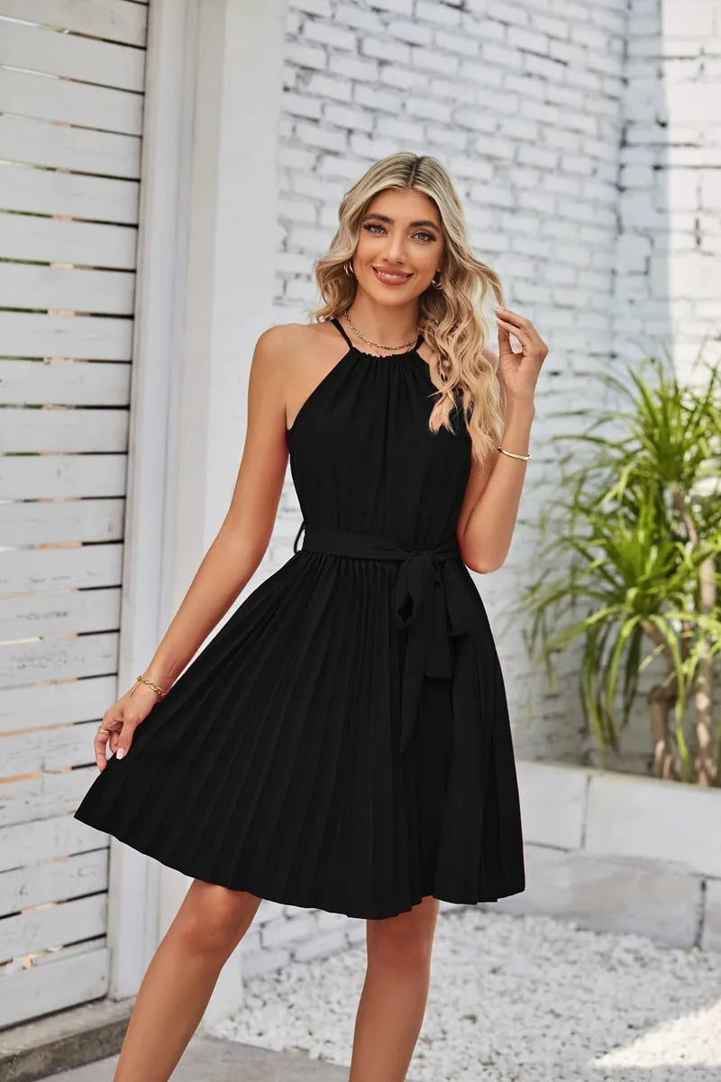 Women's black halter neck strapless dress with pleated midi skirt and waist belt