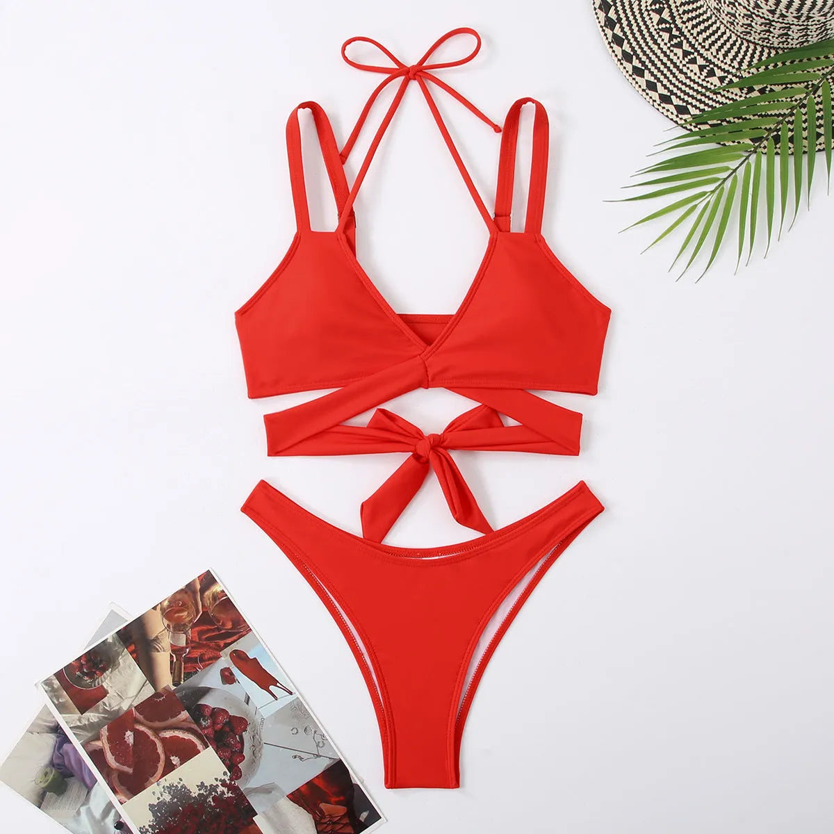 Women's solid colour strap bikini swimsuit in a brief style on a white background.