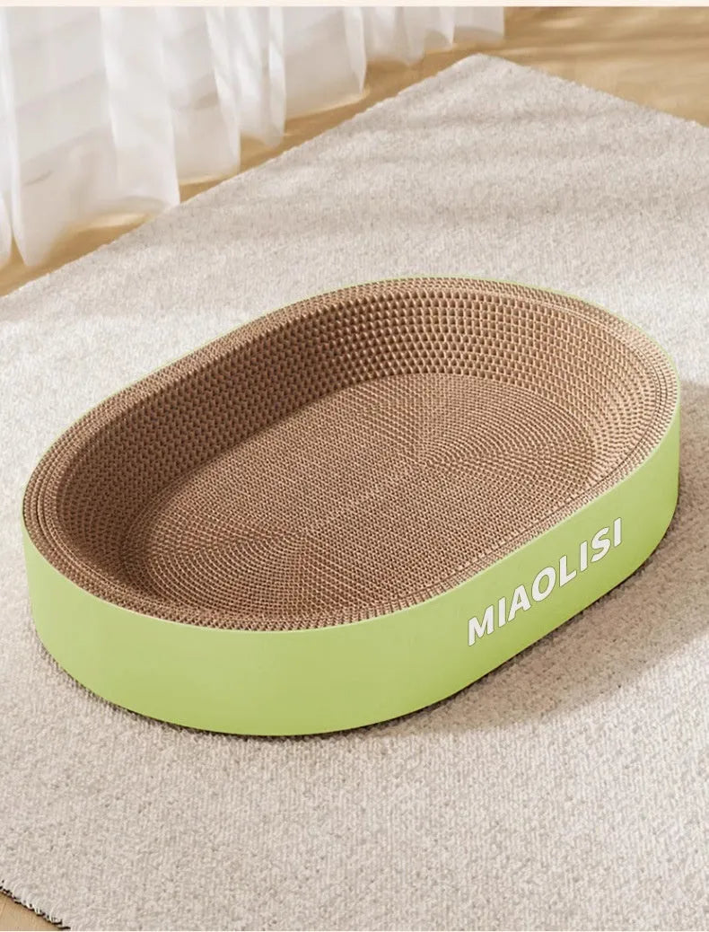 Large green oval cat scratch board and nest made from corrugated paper