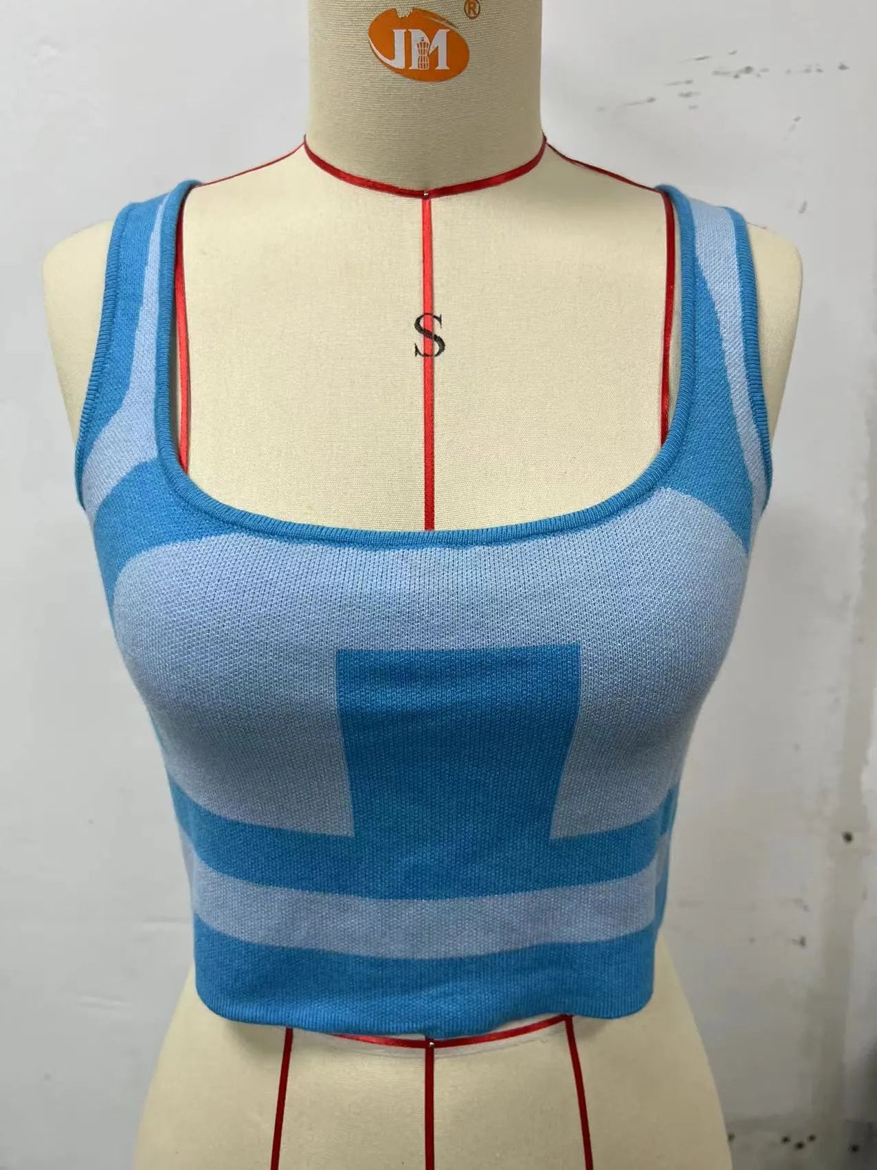 Women's slim fit U-neck camisole top in core-spun polyester fabric, shown in one of five colour options.