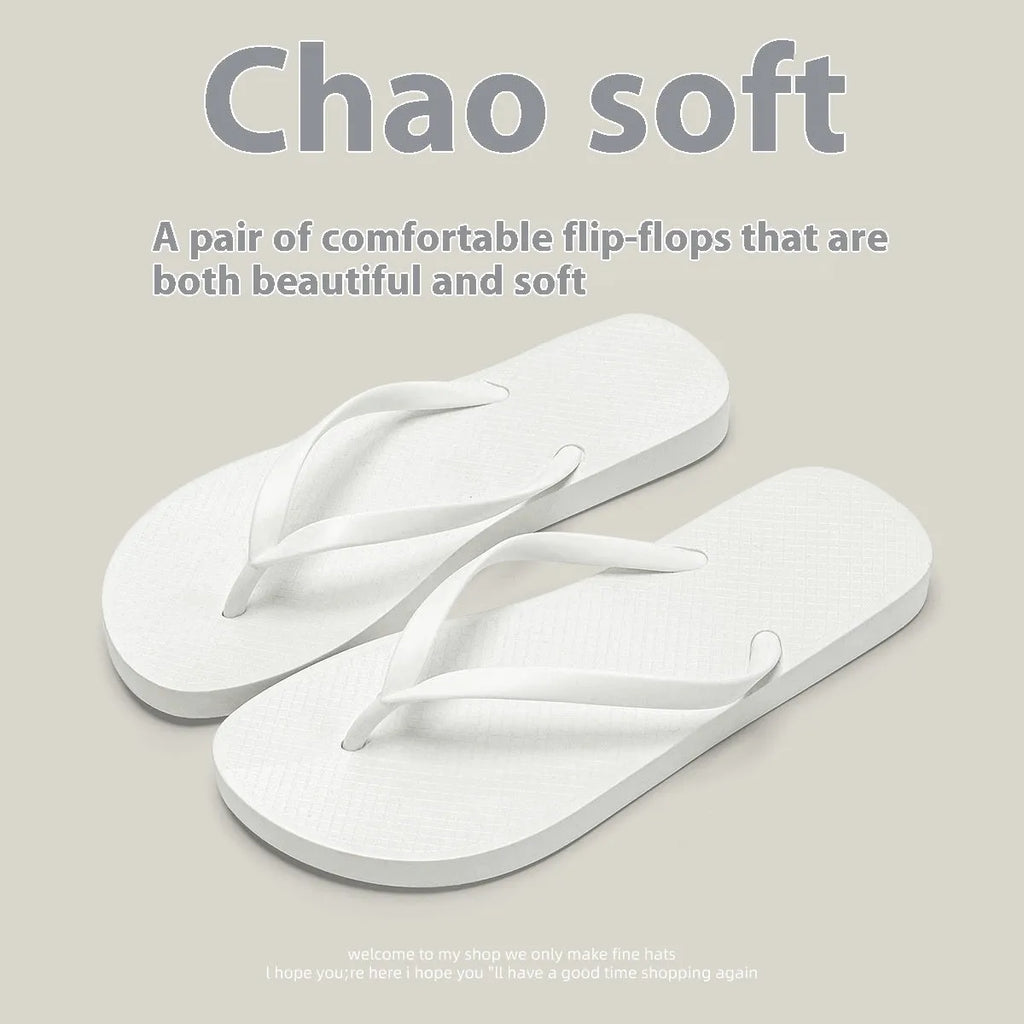 A pair of flat casual slippers with a hollow-out plastic upper and a textured non-slip PVC sole.