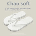 A pair of flat casual slippers with a hollow-out plastic upper and a textured non-slip PVC sole.
