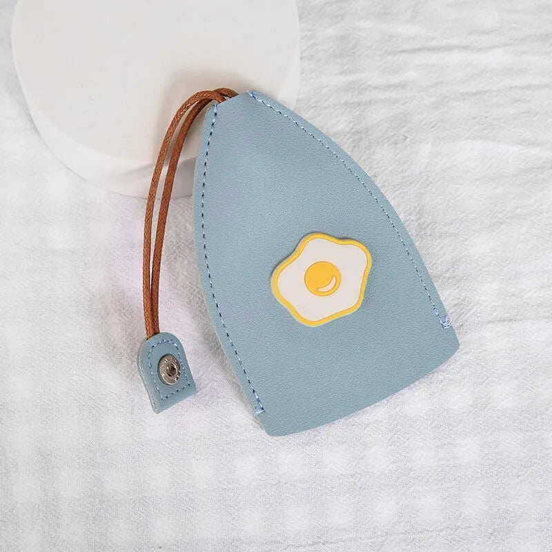 Cartoon pull-out car key case in PU leather with colourful designs measuring 14 x 7.5 cm