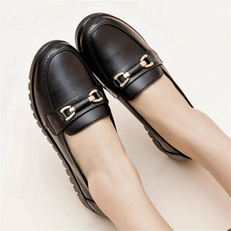 Black microfiber casual pumps with a round toe and low flat heel