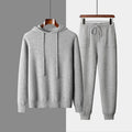 Men's dark grey cashmere hooded sweatshirt and trousers winter casual set laid flat