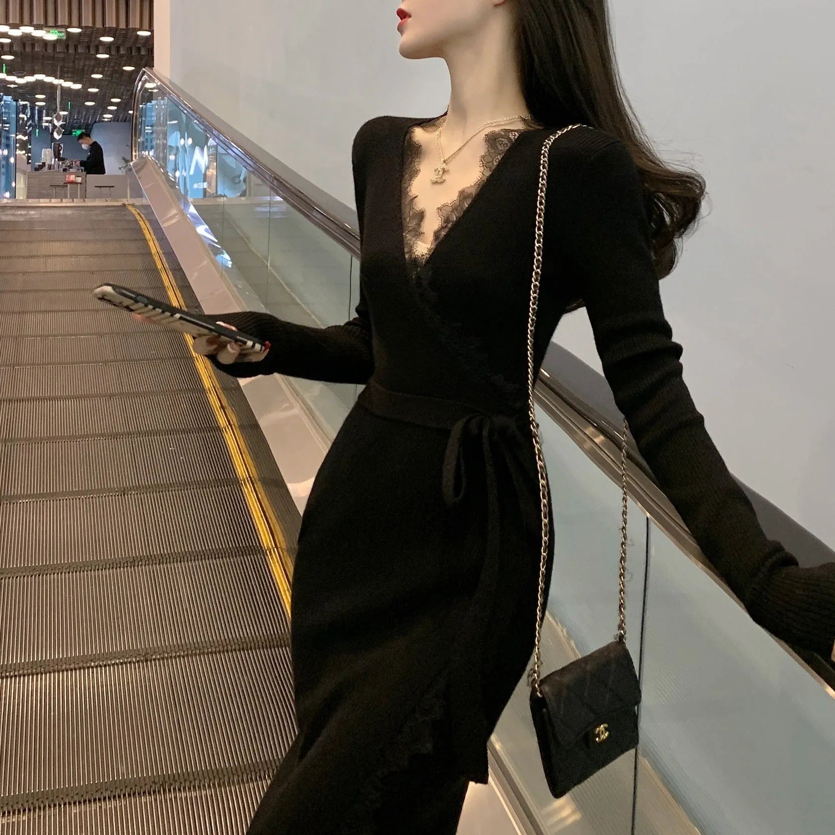 Black slim fit woolen skirt with princess dress styling on dress form
