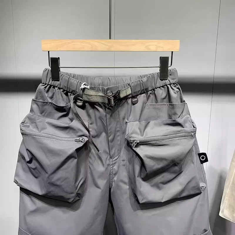 Men's black loose fitting workwear shorts with pockets, above-the-knee length with straight leg design