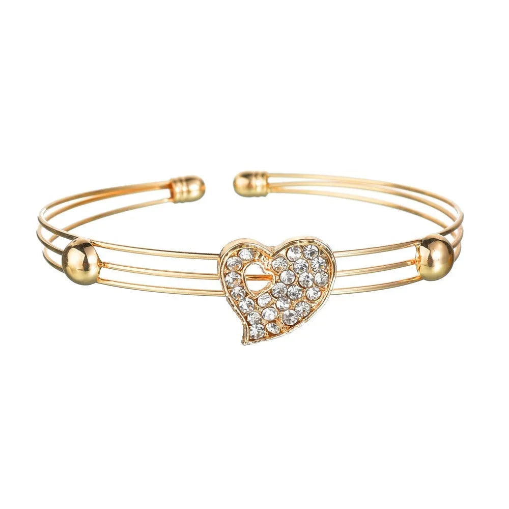 Women's gold electroplated alloy jewellery set with adjustable necklace, earrings, and bracelet