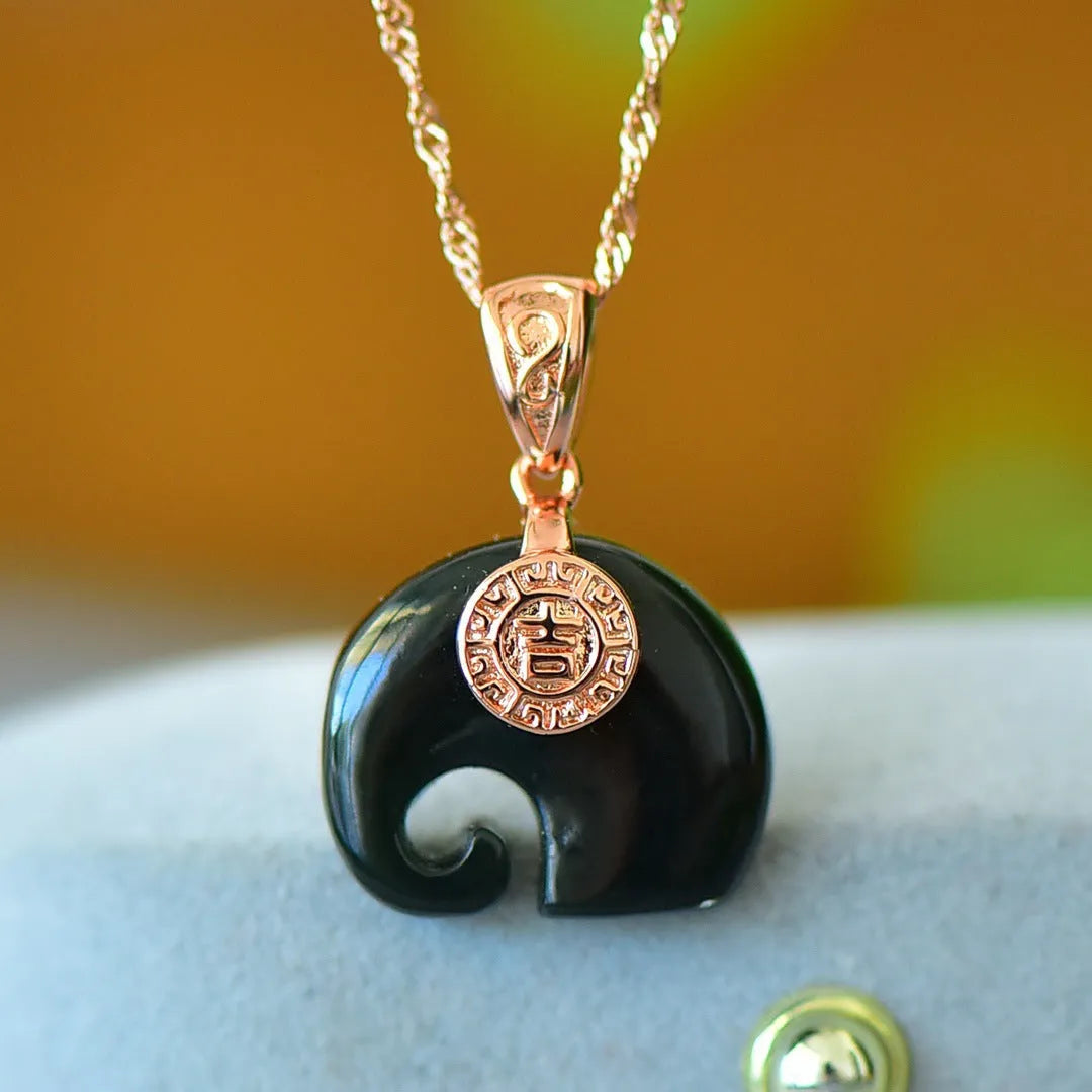 Gray Hetian jade pendant with copper inlay detailing on necklace chain
