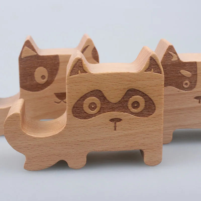 Solid beech wood mobile phone holder with detailed resin animal carving in choice of 22 animal styles