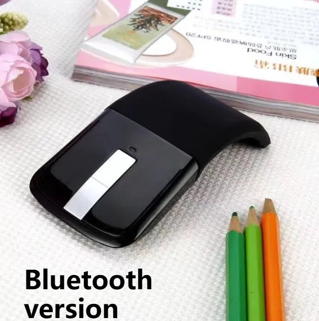 Folded black Bluetooth wireless mouse showing compact 131.2mm length and touch control surface