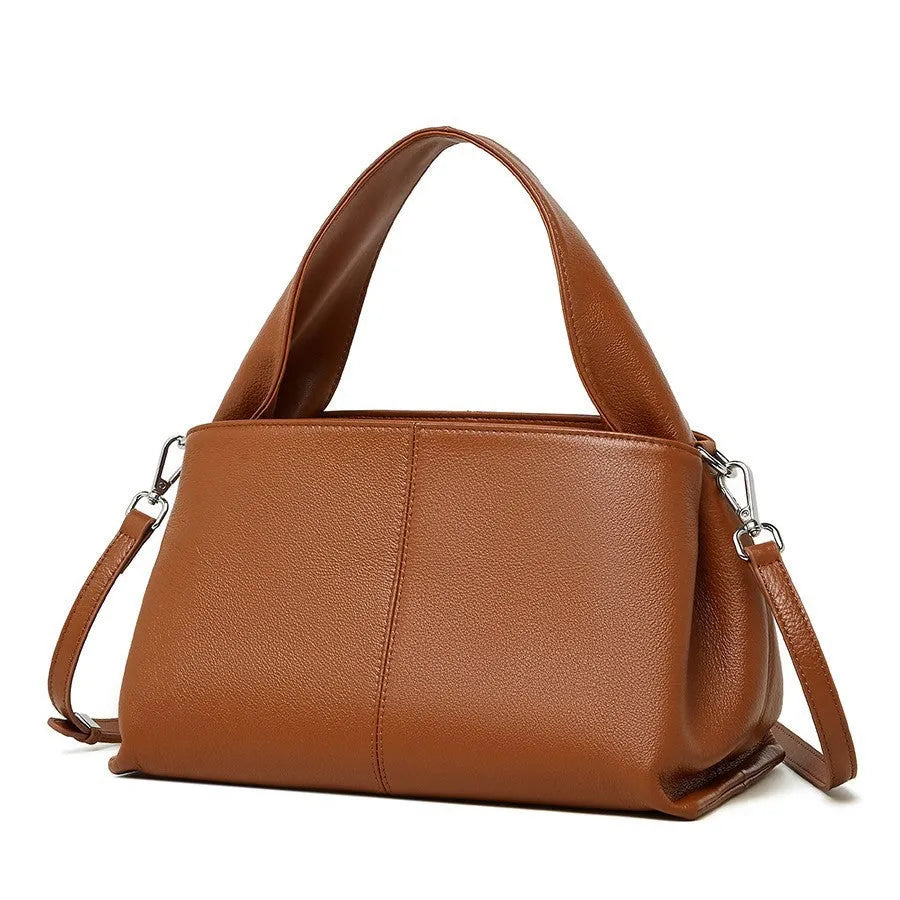 Women's genuine leather messenger bag in horizontal square shape with double shoulder strap, shown in apricot colour.