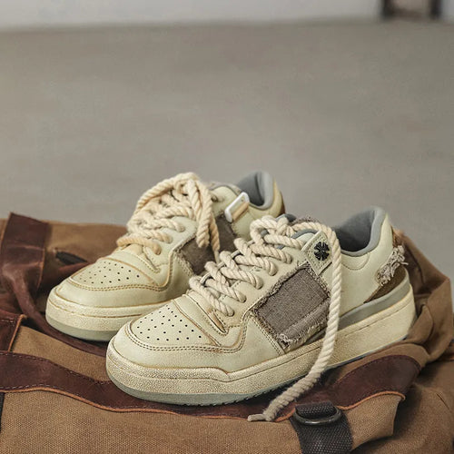 Beige vintage style low-top skateboard shoes with round toe and lace-up front