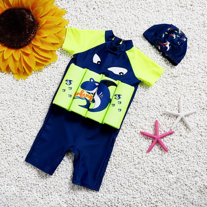 Shark boy patterned buoyancy swimsuit for children in a pool setting.